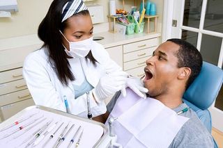Dentist examining patient - general dentistry in Gurnee, IL Dentist examining patient - general dentistry in Gurnee, IL