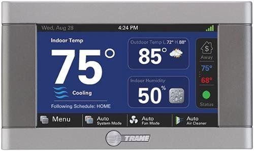 A trane thermostat is shown on a white background.