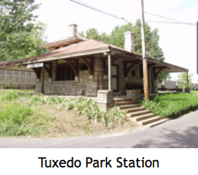 Tuxedo Park Station, a stone building with a covered porch and chimney. Steps lead up to the entrance.