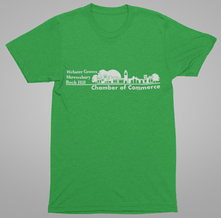 Green t-shirt with white text and a skyline design for the Webster Groves, Shrewsbury, and Rock Hill Chamber of Commerce.