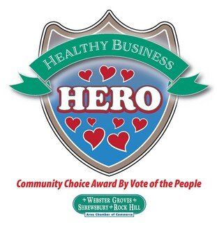 Healthy Business Hero award logo: Shield with teal banner, red hearts, text 