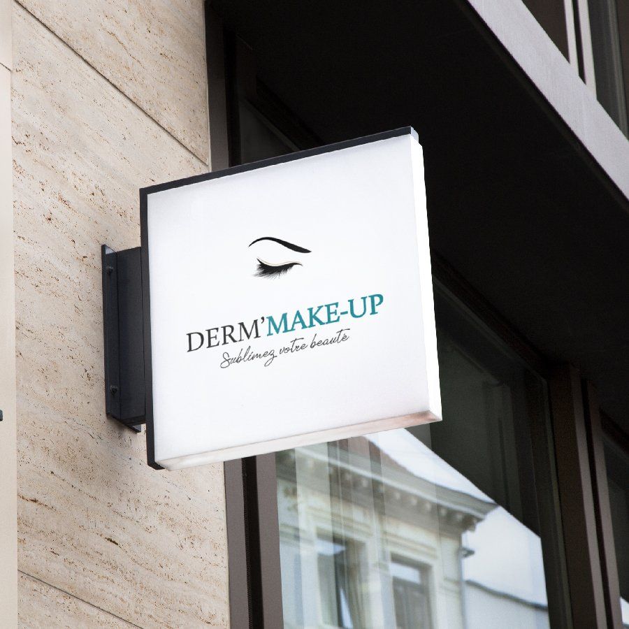 Un panneau sur le côté d'un bâtiment qui dit maquillage dermatologique