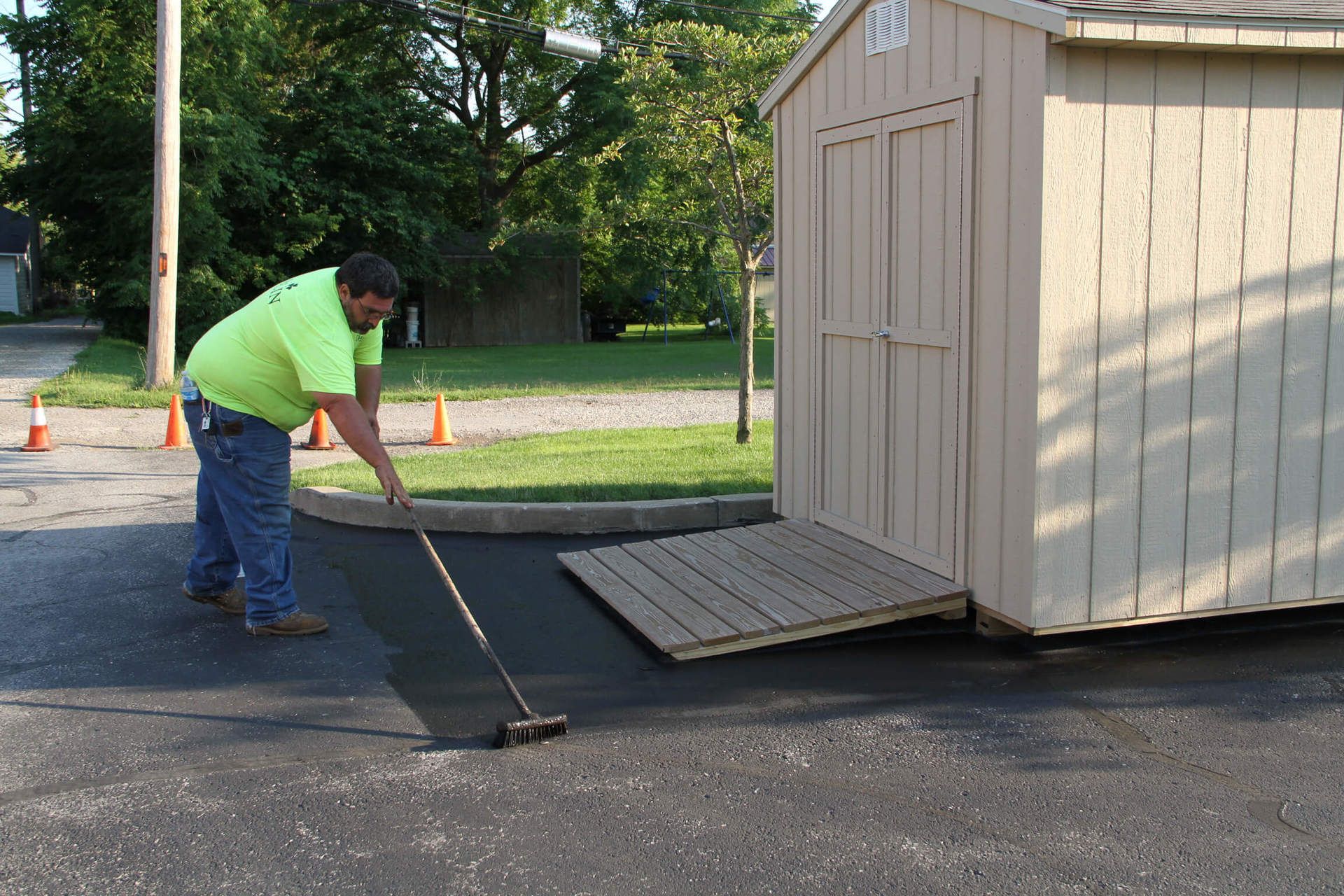 Dublin CPS technician sealcoating a parking lot