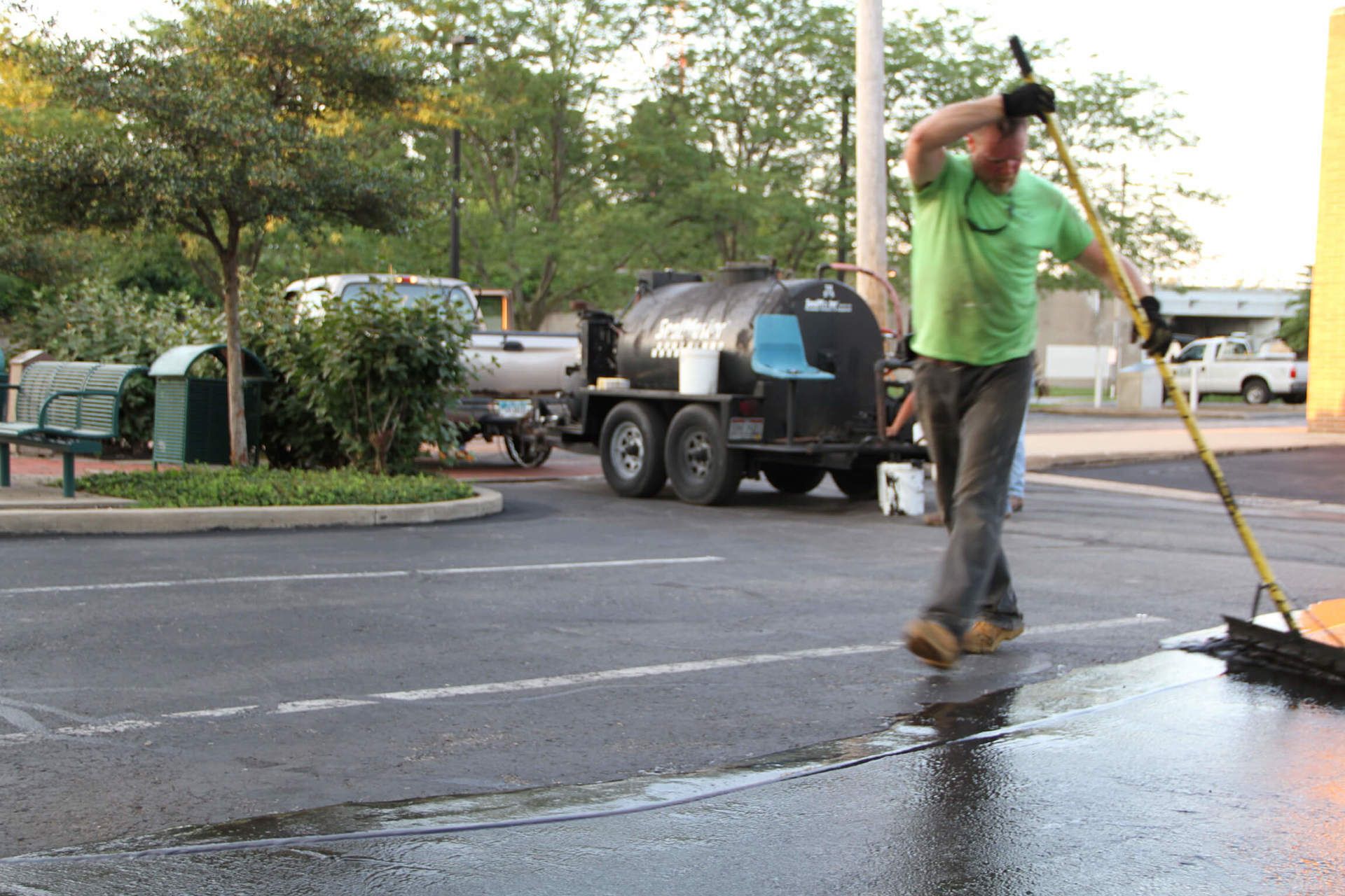 Dublin CPS technician sealcoating a parking lot
