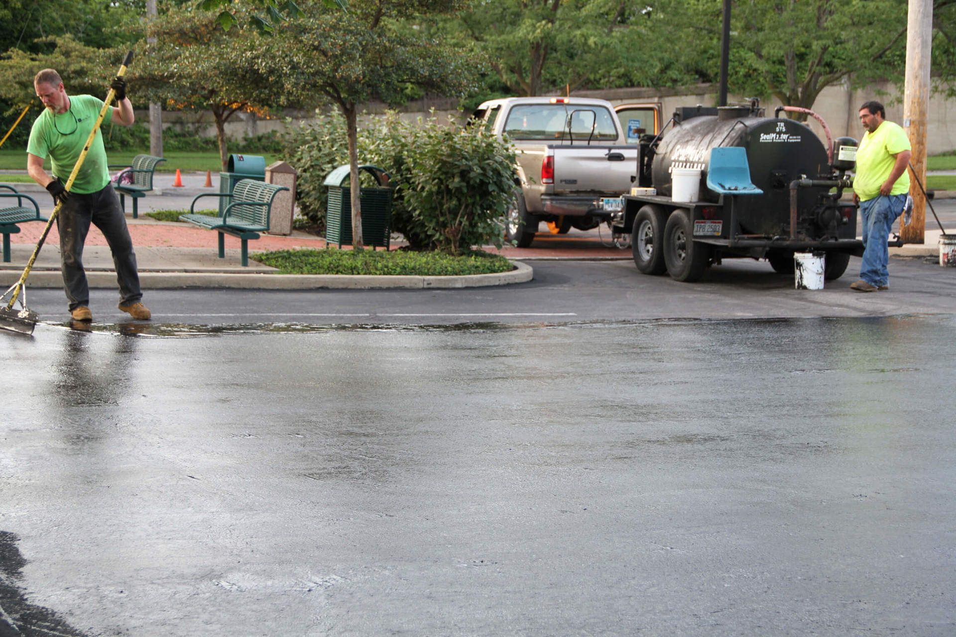 Dublin CPS technician sealcoating a parking lot