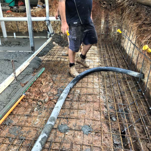 concrete footing being poured