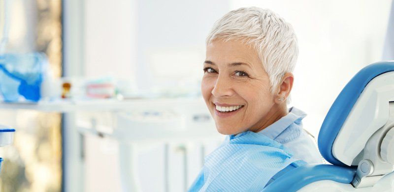 older woman sitting in dental chair