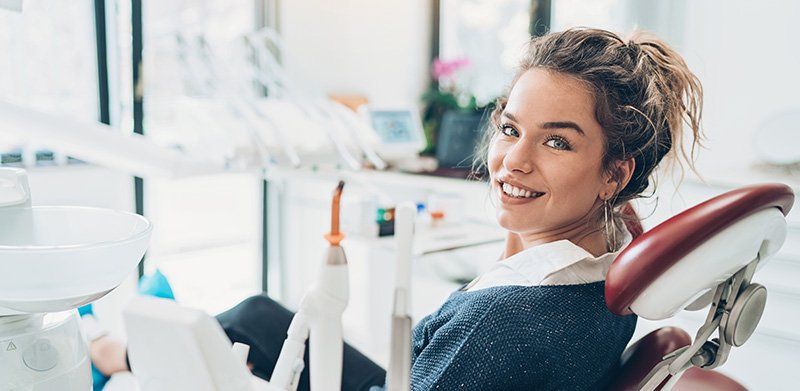 woman sitting in dental chair