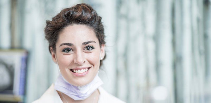 smiling woman at dentist office