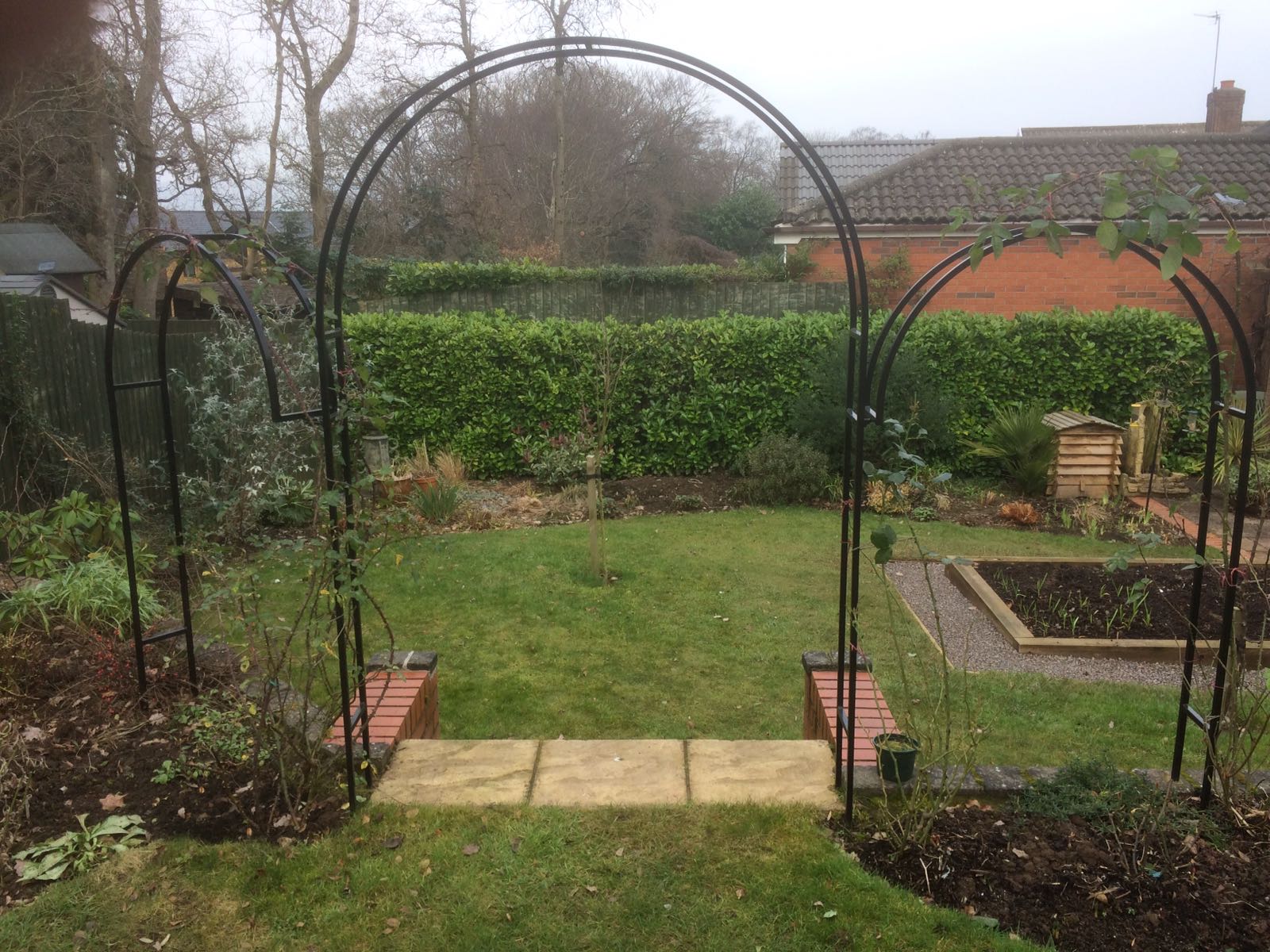 an arch in a garden