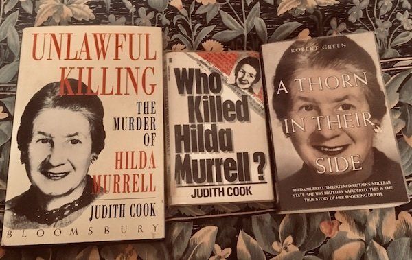 Three books about the murder of Hilda Murrell, displayed side-by-side on a floral patterned surface.