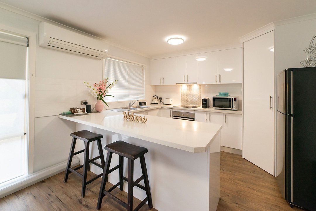 Modern luxury fully equipped kitchen at Hideaway Villa, Halls Gap Valley Lodges.