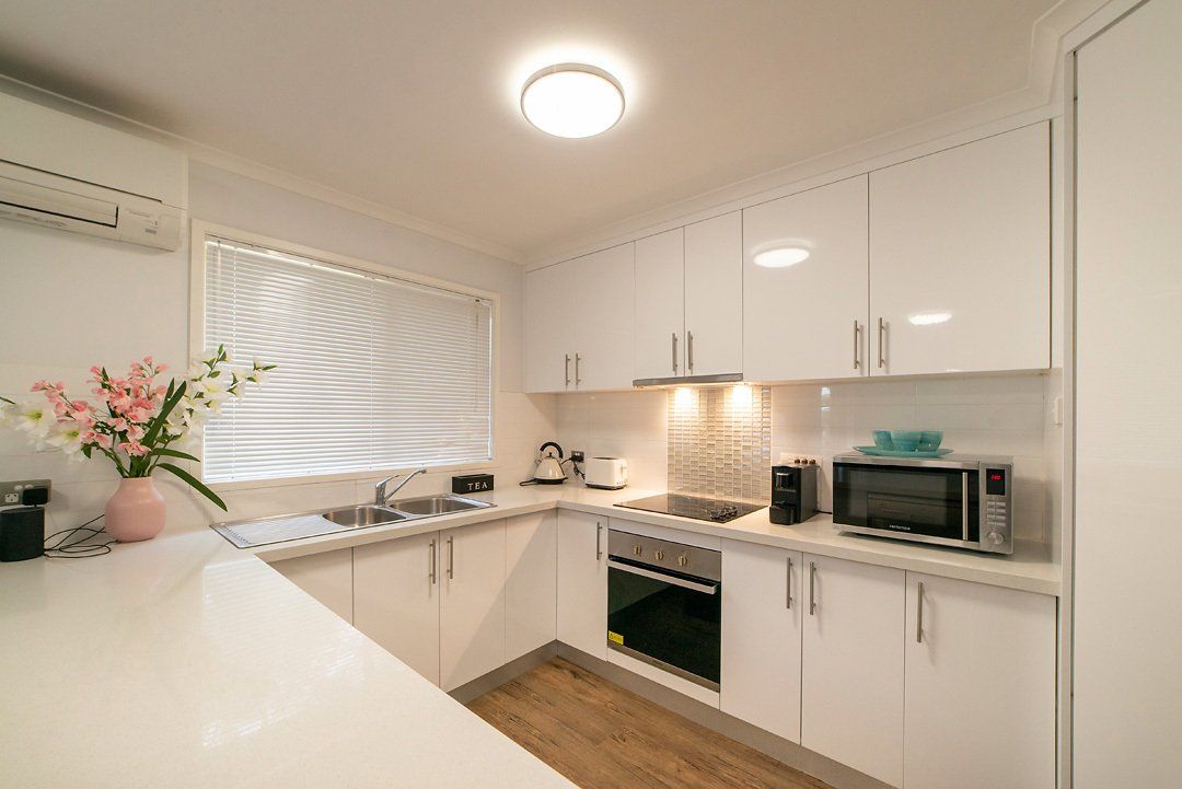 Modern luxury fully equipped kitchen at Hideaway Villa, Halls Gap Valley Lodges.
