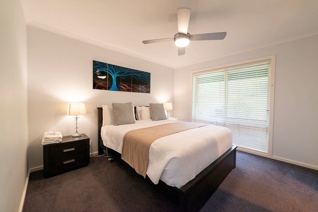 Second bedroom with luxurious Queen bed and en-suite bathroom at Hideaway Villa, Halls Gap Valley Lodges.