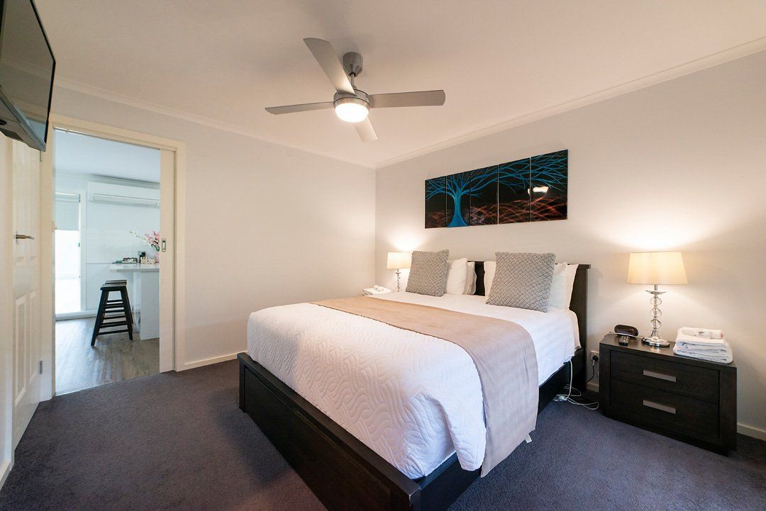 Second bedroom with luxurious Queen bed and en-suite bathroom at Hideaway Villa, Halls Gap Valley Lodges.