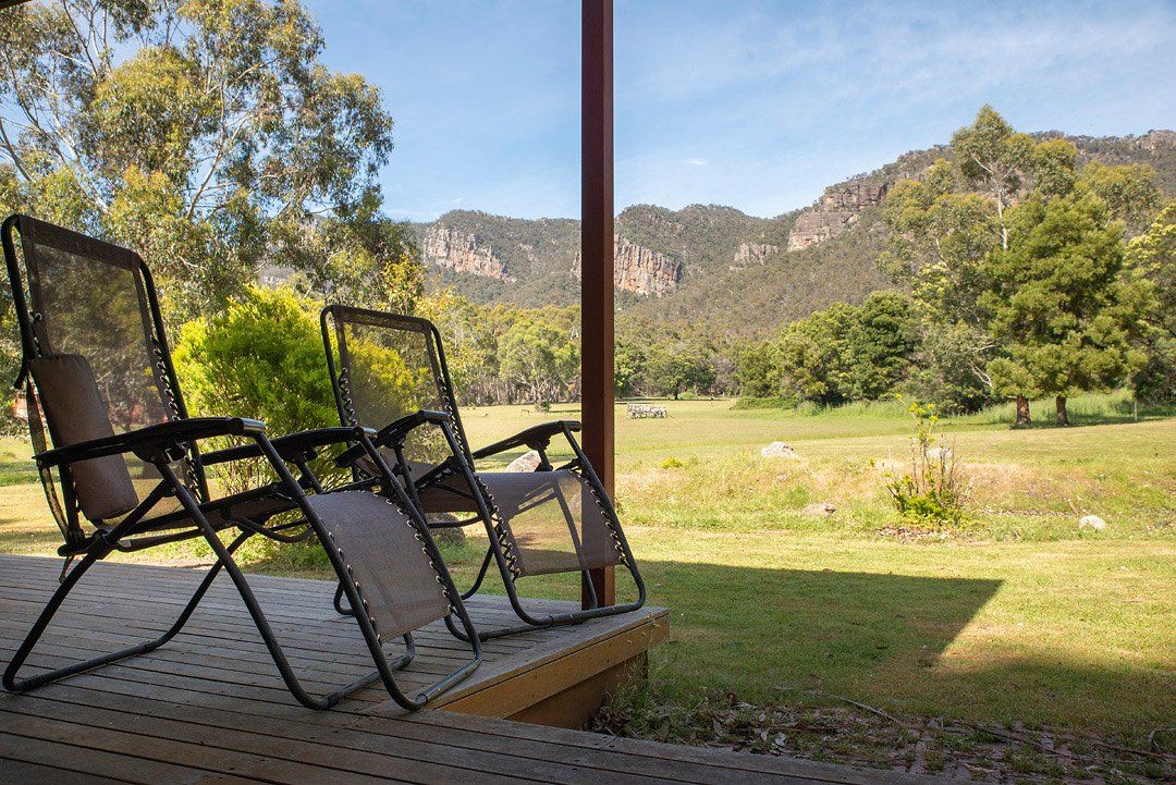 Hideaway Villa Rear Deck with BBQ looking out to Serra Range mountains. Halls Gap Valley Lodges.