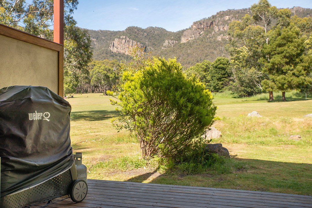 Hideaway Villa Rear Deck with BBQ looking out to Serra Range mountains. Halls Gap Valley Lodges.