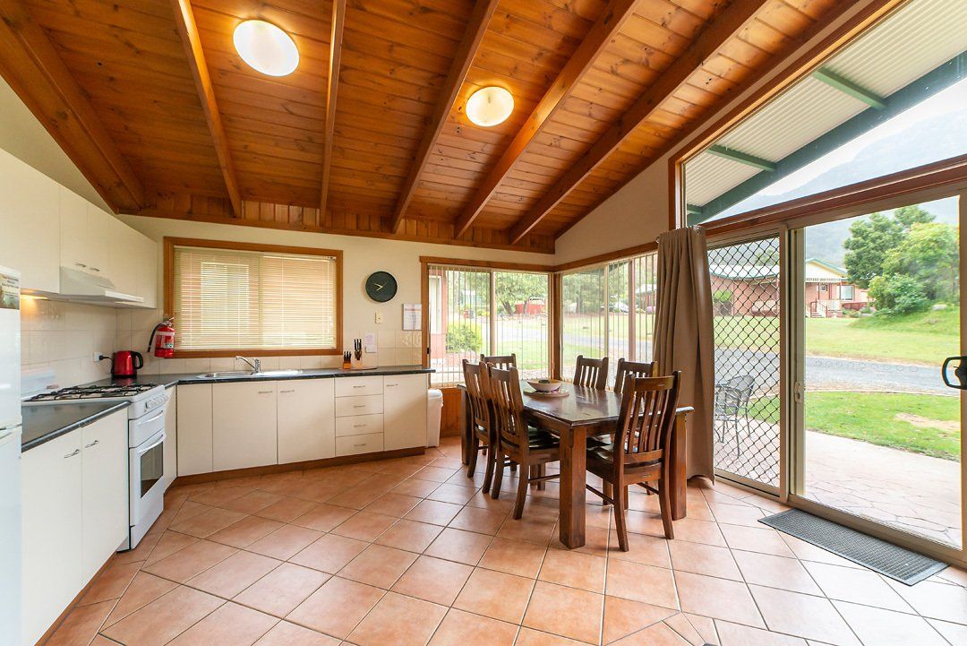 Fully equipped kitchen and dining area inside the self-contained Halls Gap accommodation.