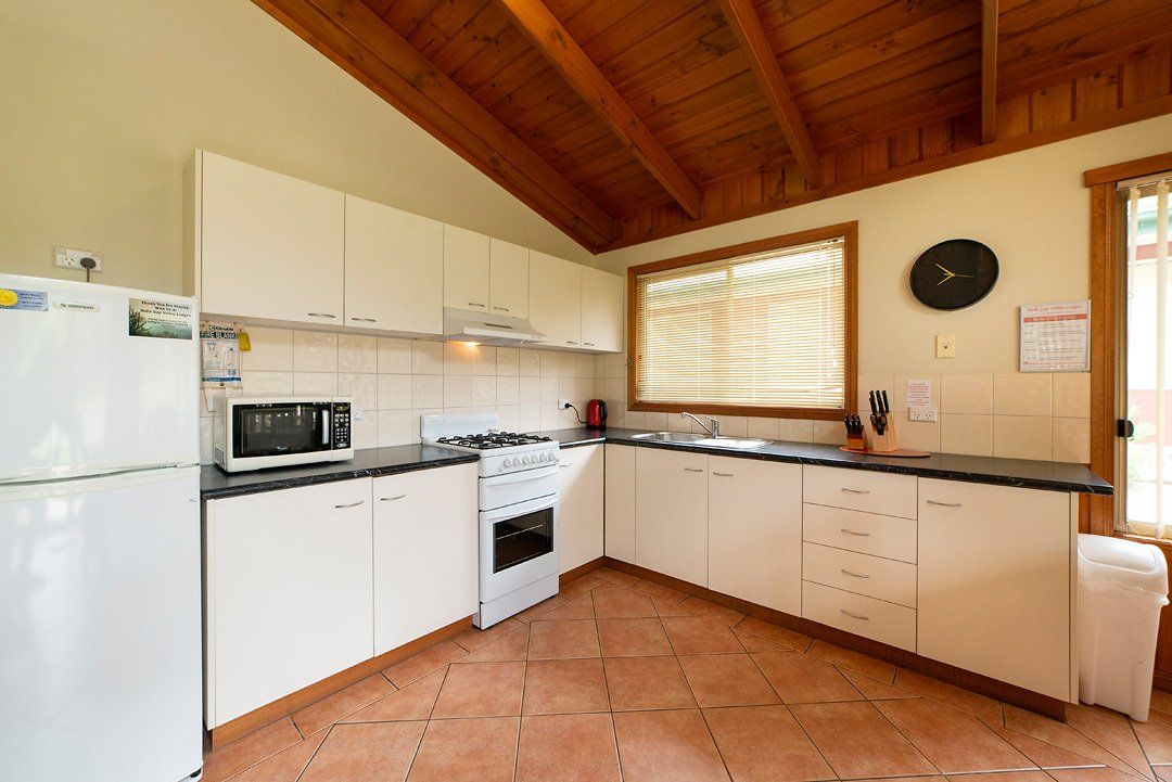 Fully equipped kitchen and dining area in chalet-style self-contained Halls Gap Valley Lodges.