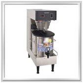 Commercial stainless steel coffee maker with a black top and spigot.
