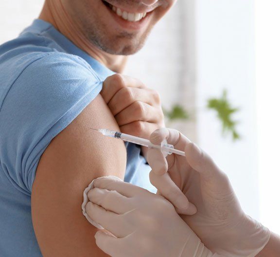 Man happily taking vaccination - Vaccination in Camden North Haven, NSW Man happily taking vaccination - Vaccination in Camden North Haven, NSW