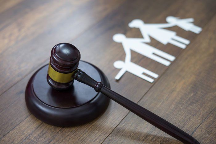 Family figure and gavel on the table — Casper, WY — Chapman, Valdez, & Lansing Family figure and gavel on the table — Casper, WY — Chapman, Valdez, & Lansing