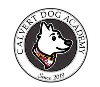 Logo for Calvert Dog Academy: white dog wearing Maryland flag bandana, in a circular frame.