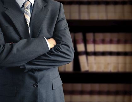 Businessman in front of books - Law Office in in Wake Forest, NC