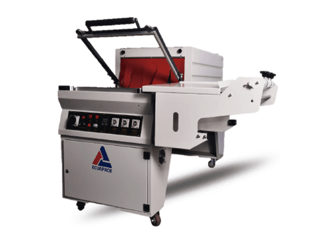 Máquina de prensado térmico industrial con tapa abierta, cuerpo gris, interior rojo y extensión de cinta transportadora blanca.