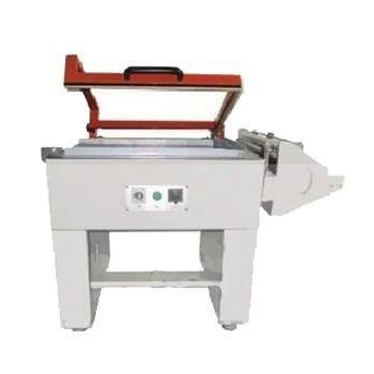 Máquina industrial roja y blanca con asa y panel de control frontal sobre fondo blanco.