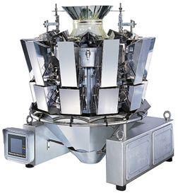Máquina industrial de acero inoxidable con paneles espejados y una pantalla de control sobre un fondo blanco.