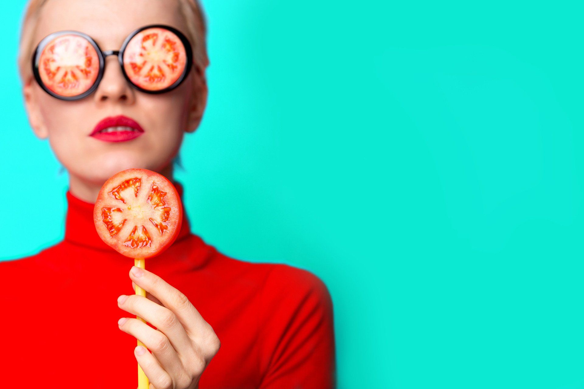 person with tomatoes