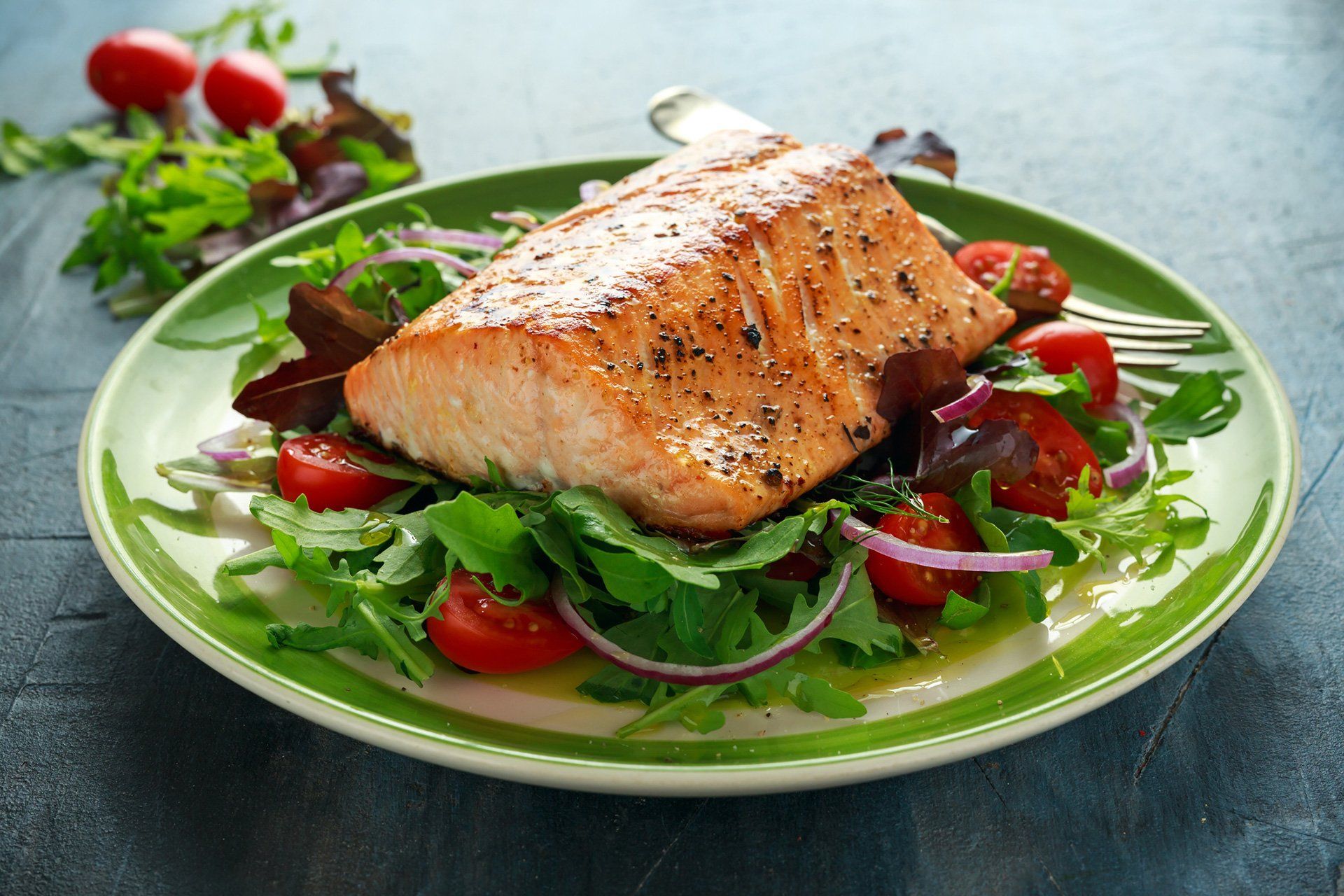 fish on salad on a plate