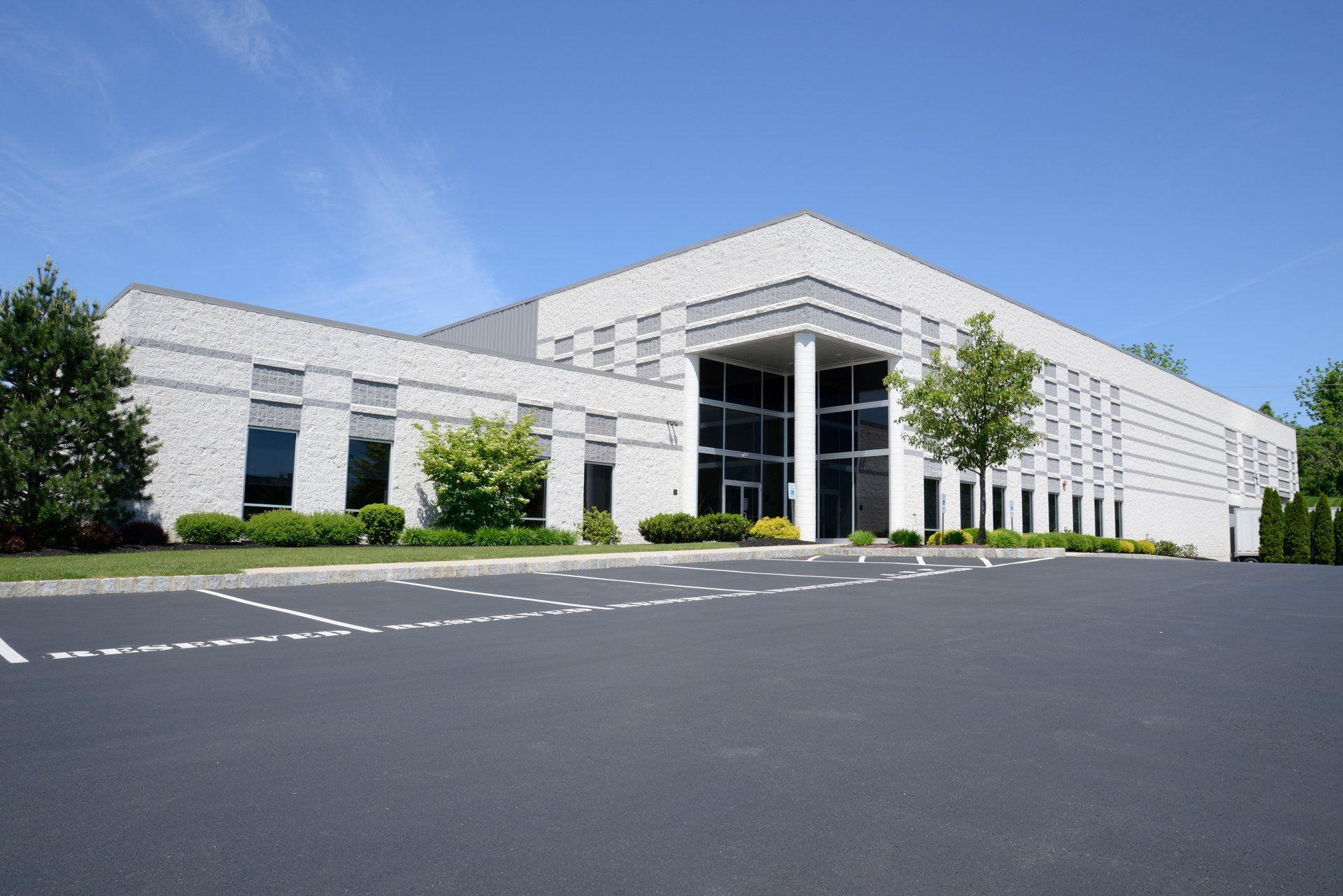 Commercial building with wide parking lot — Edinburg, TX — Lone Star Asphalt Services LLC