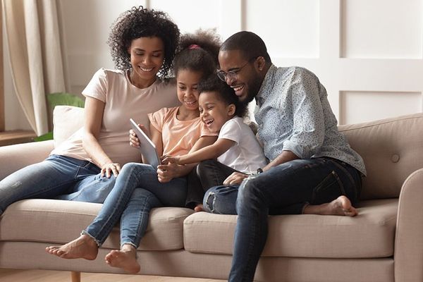 Family Sitting in the Sofa — Greenacres FL — Roy-Roth Agency