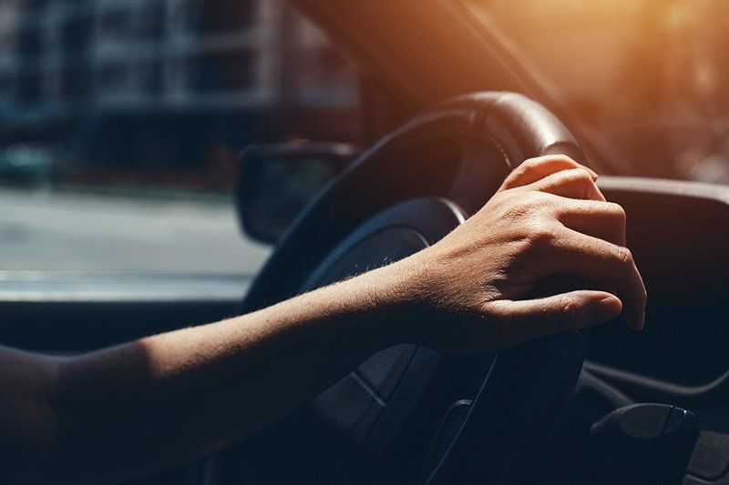 Hand Holding the Car Steering Wheel — Greenacres FL — Roy-Roth Agency Hand Holding the Car Steering Wheel — Greenacres FL — Roy-Roth Agency