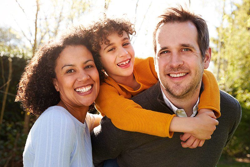 Happy Family Outside the House — Greenacres FL — Roy-Roth Agency Happy Family Outside the House — Greenacres FL — Roy-Roth Agency