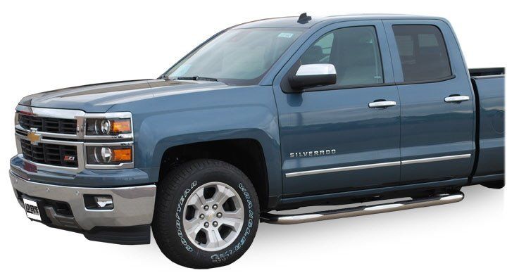 A dark pickup truck with a nerf bar installed