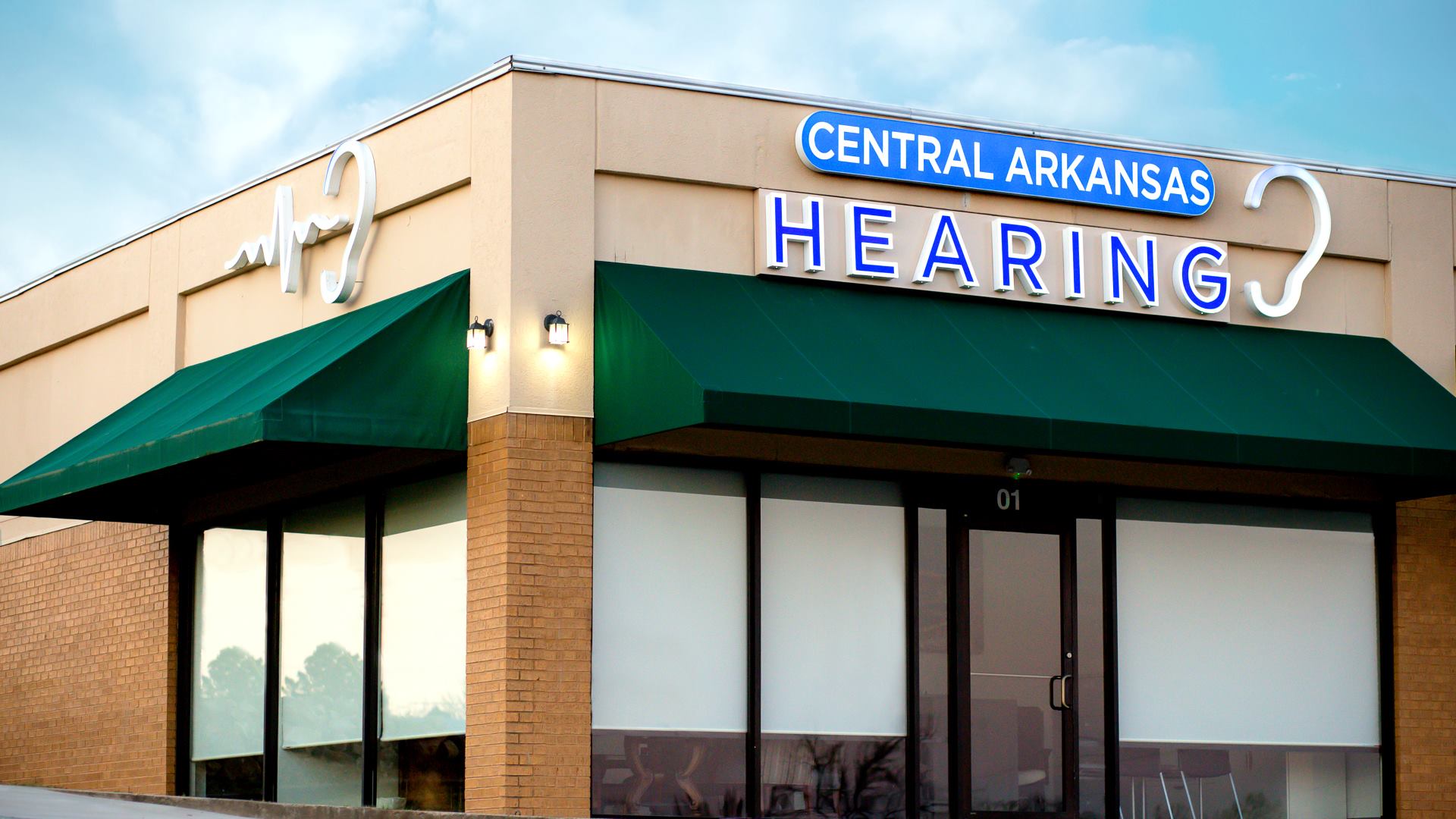 See our completed remodel of Central Arkansas Hearing Local business Central Arkansas Hearing building in Sherwood, Arkansas with blue sky in background