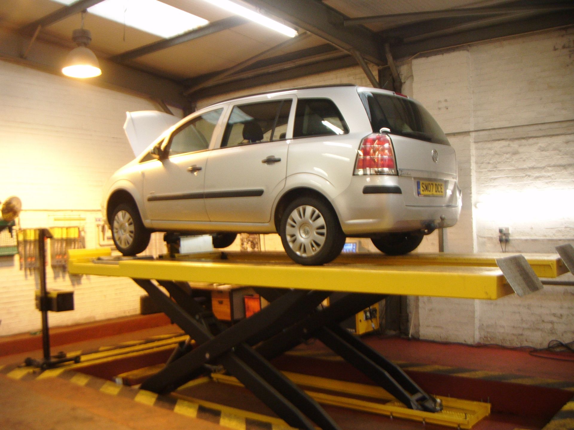 ford galaxy on hydraulic inspection hoist