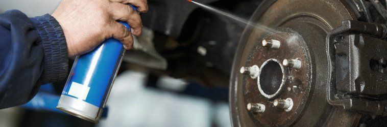 spraying a wheel disc with light oil