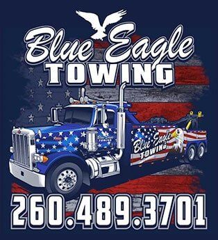 Blue Eagle Towing truck with American flag design and phone number 260-489-3701 against a patriotic backdrop.