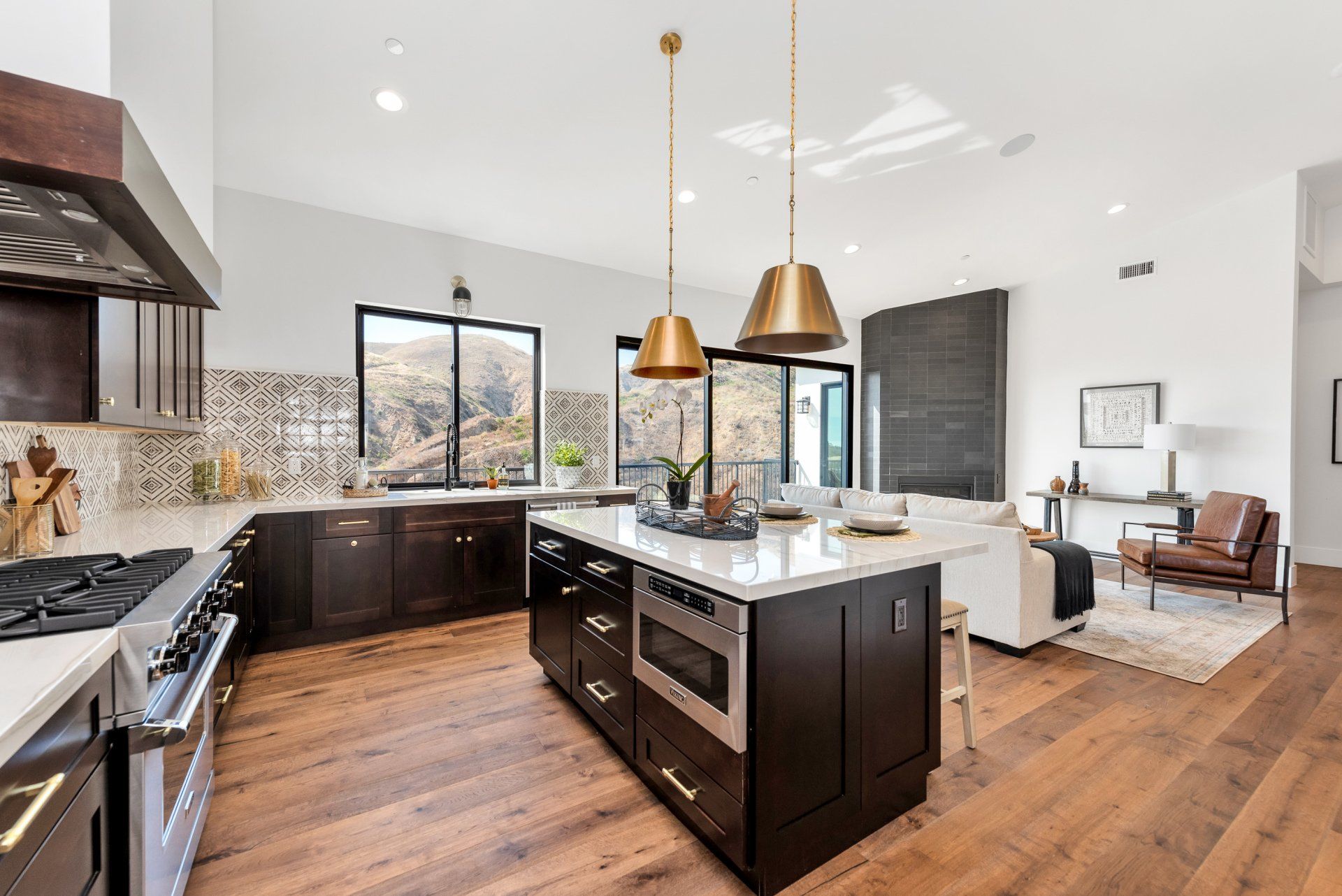 A kitchen with a large white island in the middle of the room.