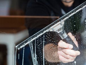Window Cleaning — Man Cleaning A Window In Mount Holly, NC