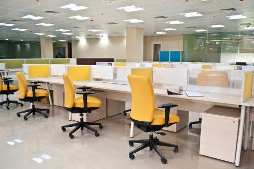 Office Tables Furniture — Office with Yellow Chair in Eatontown, NJ Office Tables Furniture — Office with Yellow Chair in Eatontown, NJ