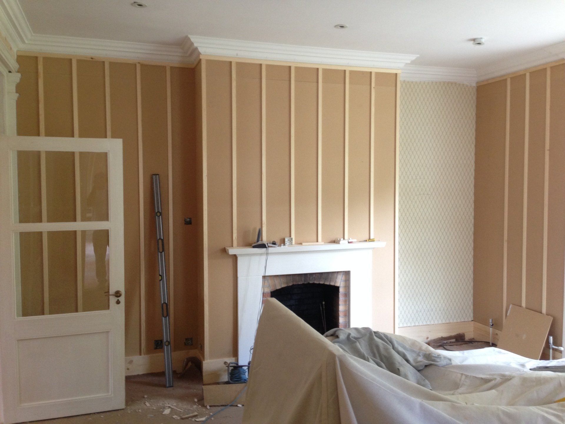living room mid work on wall panelling