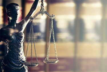 Legal aid from start to finish justice system scale sculpture