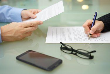 Support when you need it A client signing documents for family law in Noarlunga