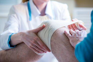 Don't let injury stop you nurse wrapping injured leg