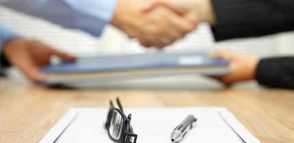 Corporate law shaking hands